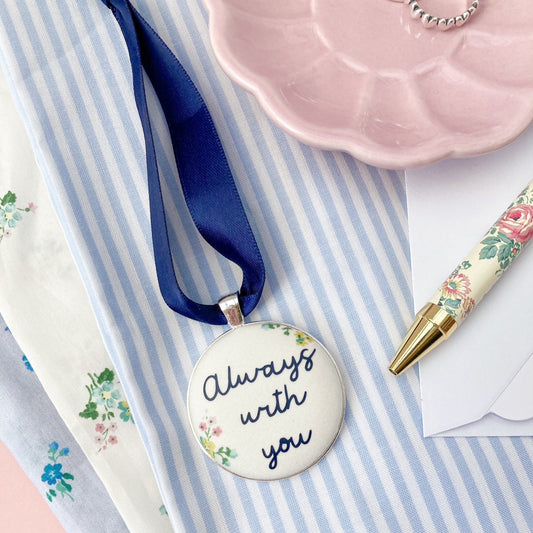 Always with you fabric keepsake hanging on a navy blue ribbon