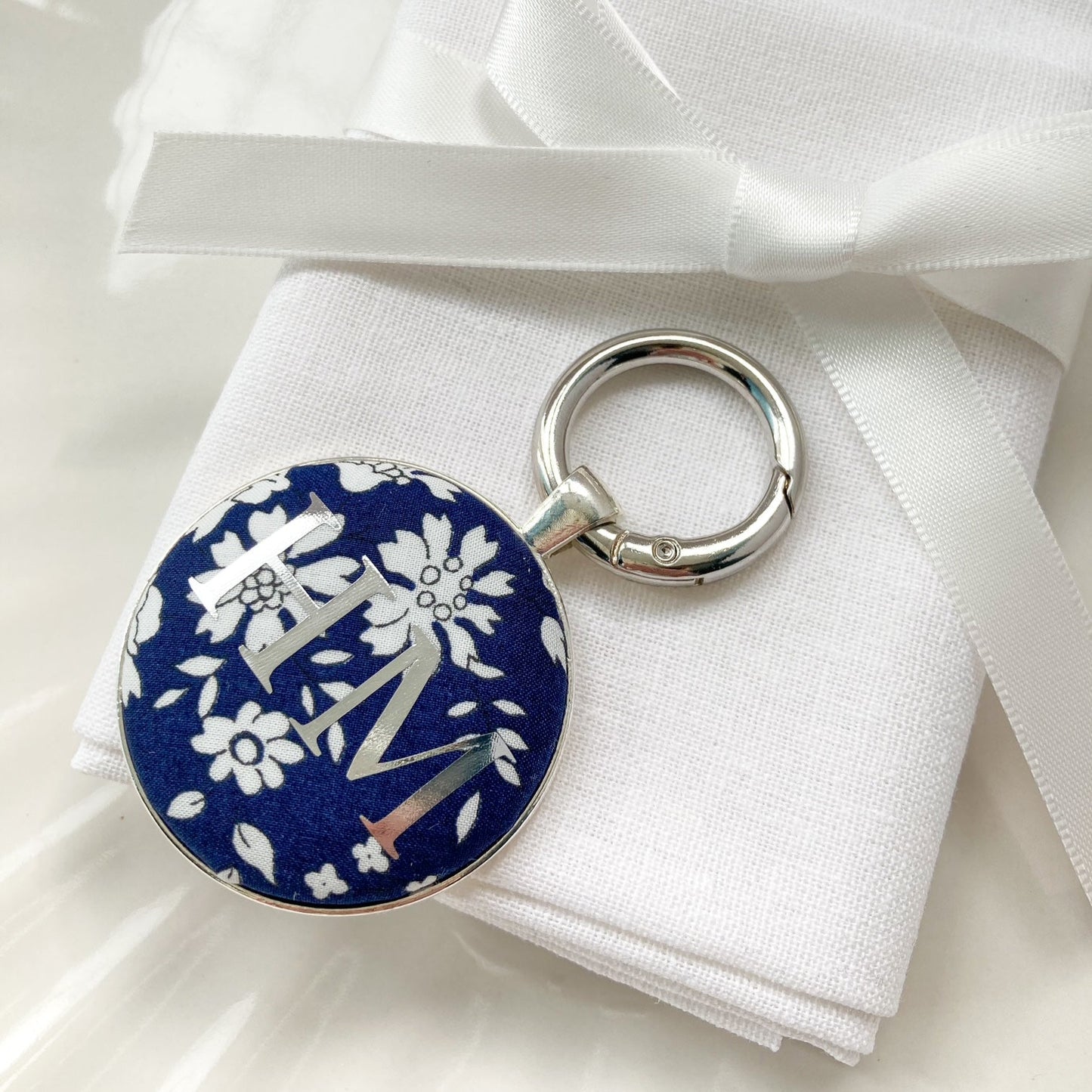 Blue floral wedding place setting keyring
