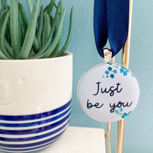Just Be You Thoughtful Keepsake on blue floral Liberty fabric with a blue ribbon