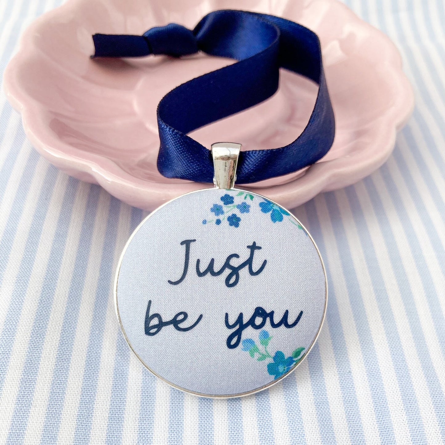 Just Be You Thoughtful Keepsake on blue floral Liberty fabric with a blue ribbon
