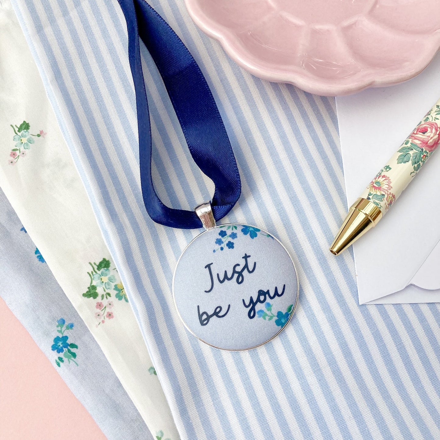 Just Be You Thoughtful Keepsake on blue floral Liberty fabric with a blue ribbon