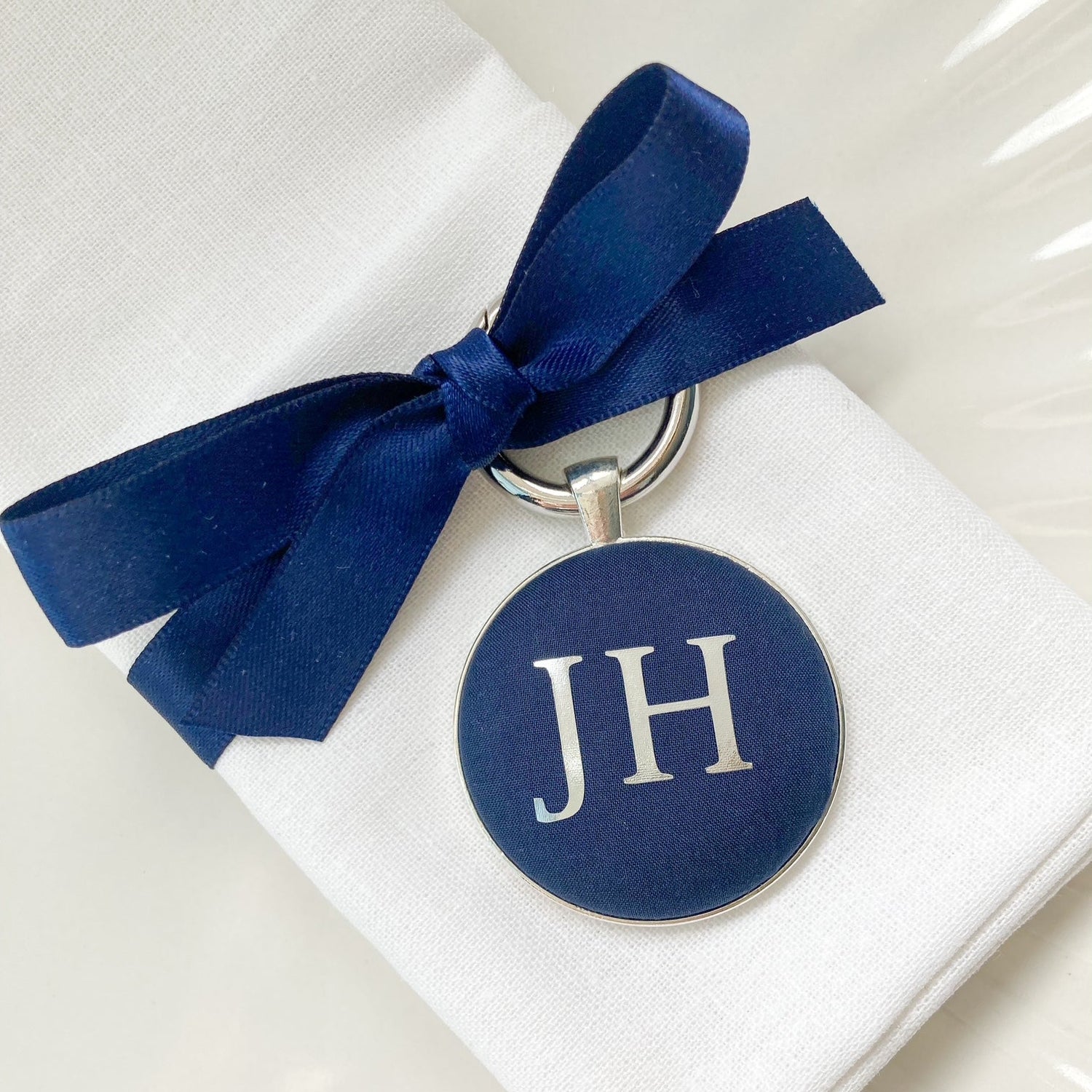 Wedding favour keyring and place setting in navy blue Liberty fabric