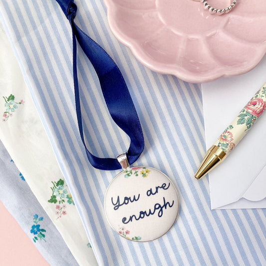 You Are Enough keepsake made with cream floral Liberty fabric on a blue ribbon