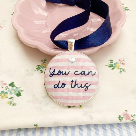 You Can Do This keepsake printed onto pink and white striped fabric with a navy blue ribbon