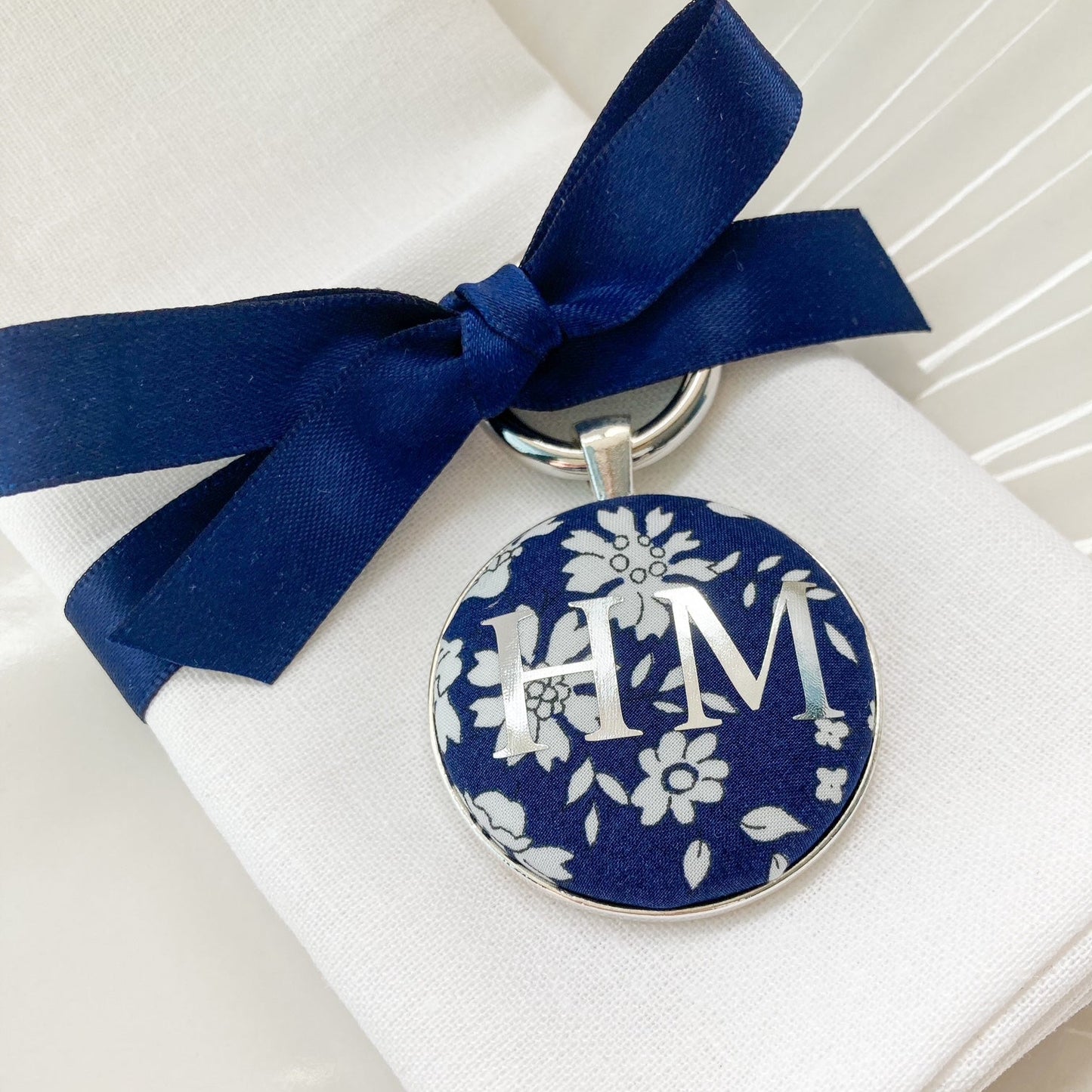 Blue floral wedding breakfast place setting and favour made with Liberty fabric