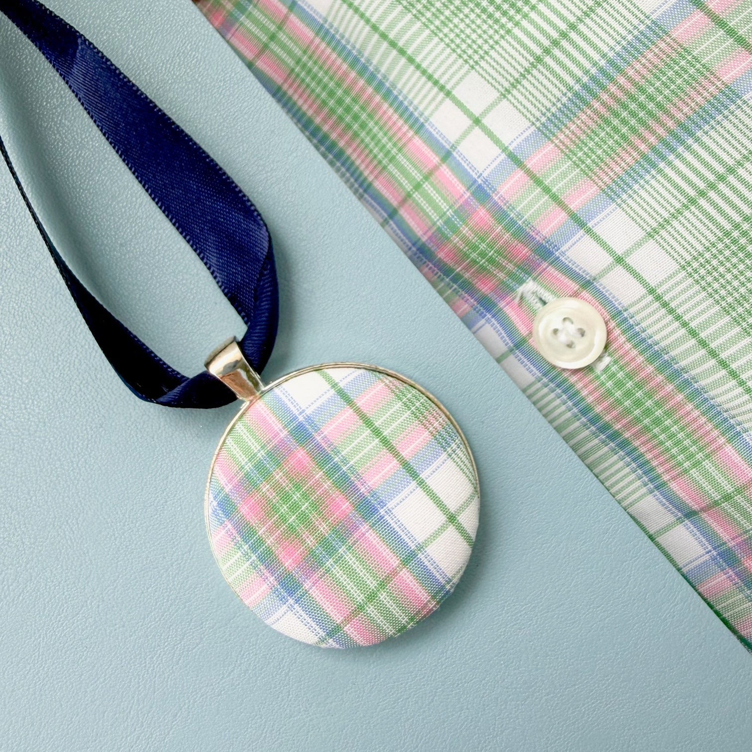 Memory fabric keepsake made with a dads checked shirt on a blue ribbon with a personalised fabric message