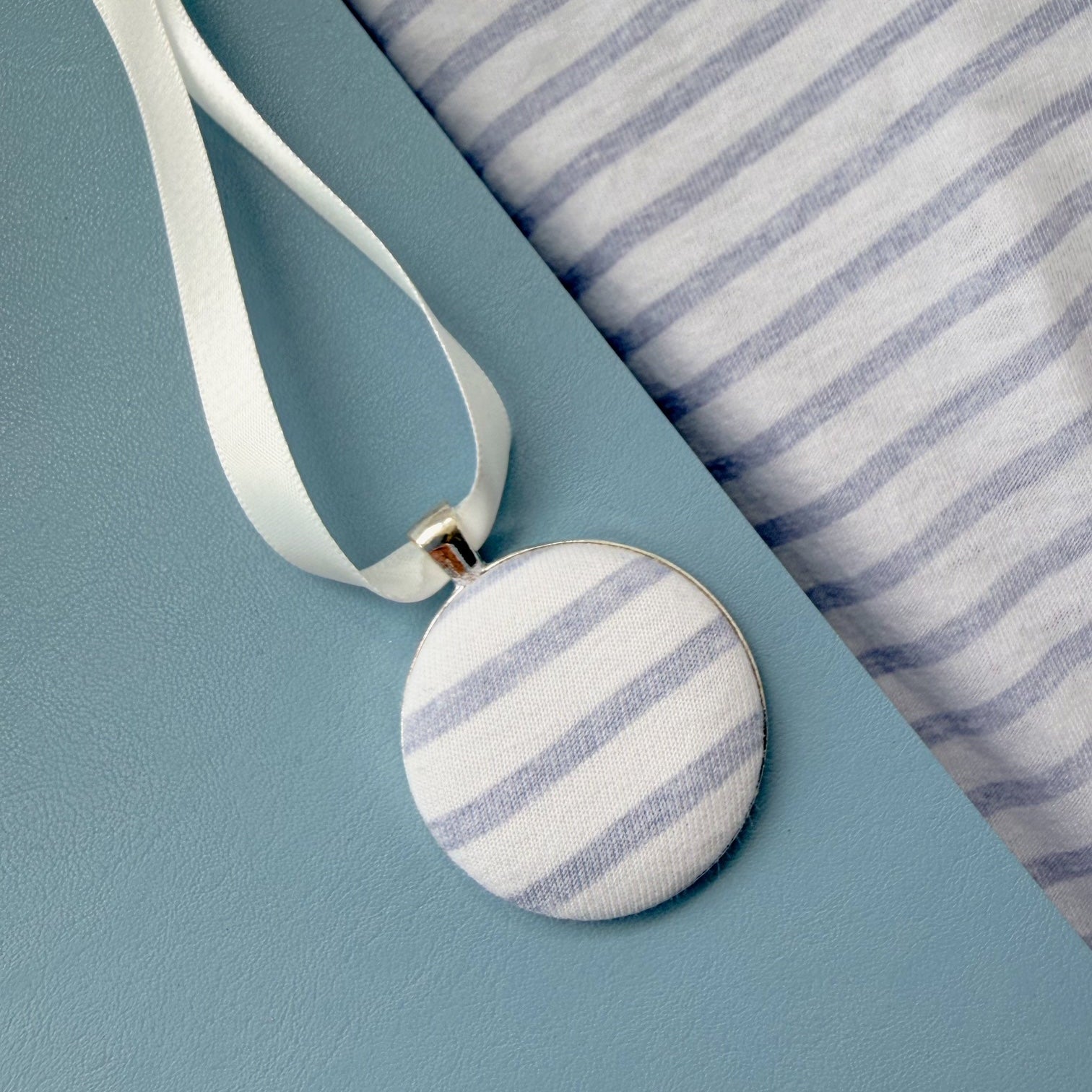 Tablecloth memory fabric keepsake thread on a white ribbon 