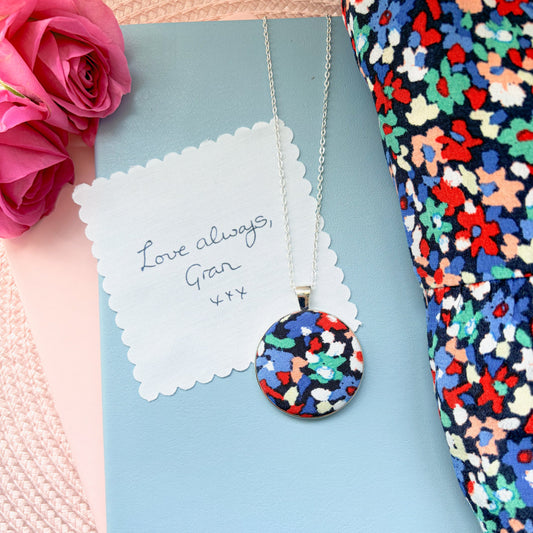 Colourful fabric pendant with a fabric handwriting message saying Love Always Gran