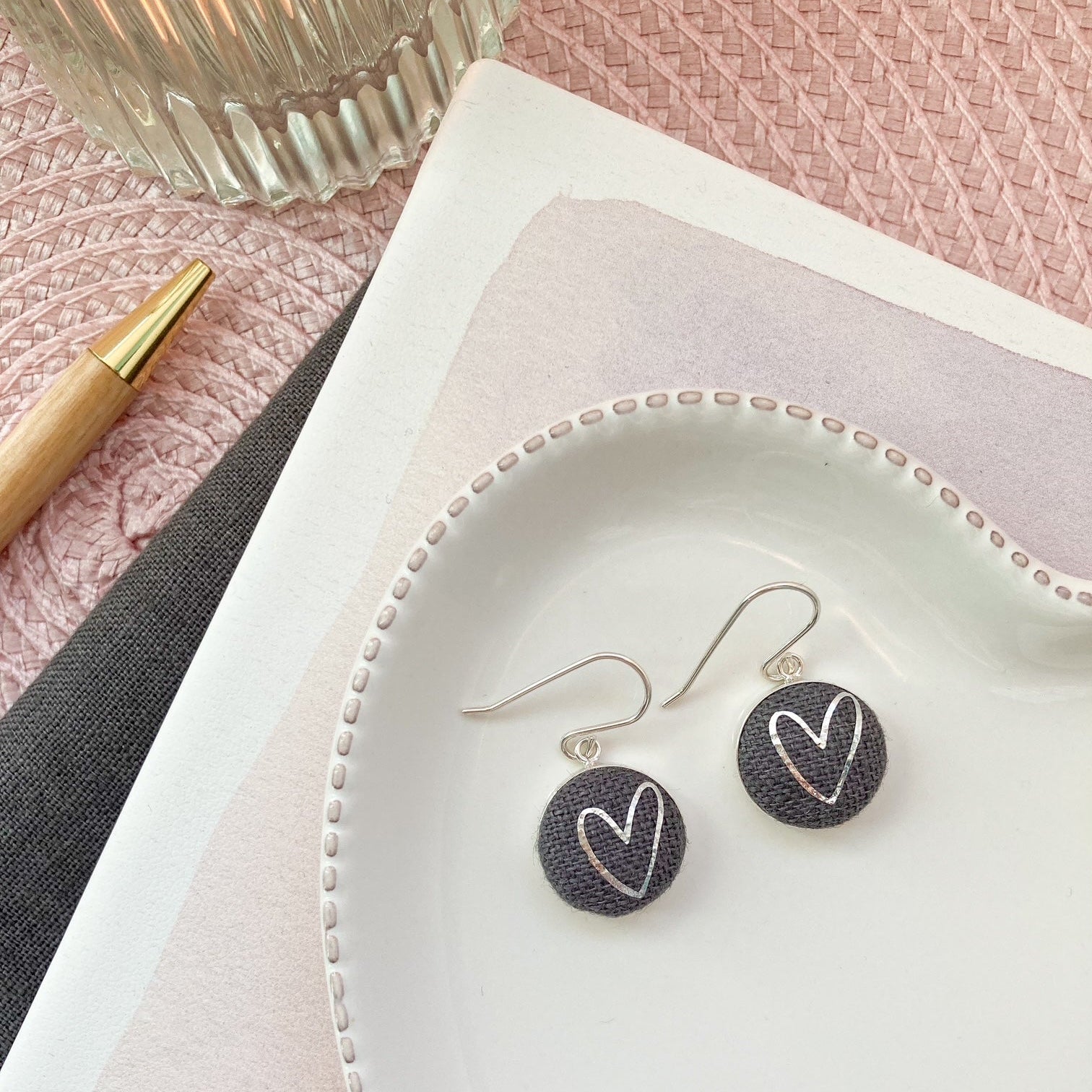 Graphite grey fabric hook earrings with silver heart design