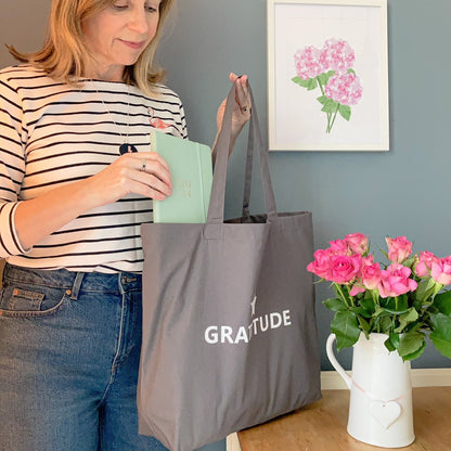 Grey large tote bag with white text Gratitude