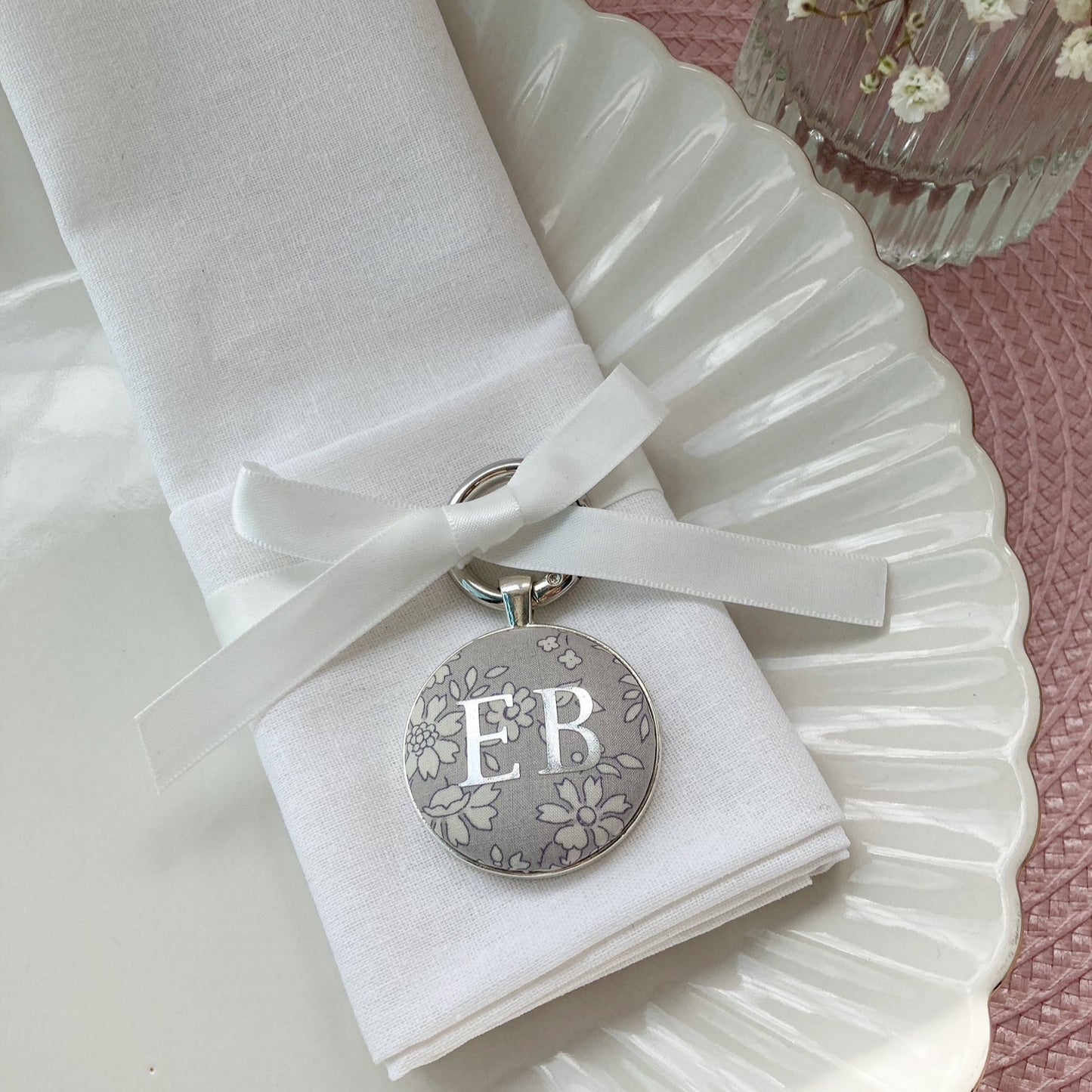Wedding place setting and favour made with grey floral Liberty fabric