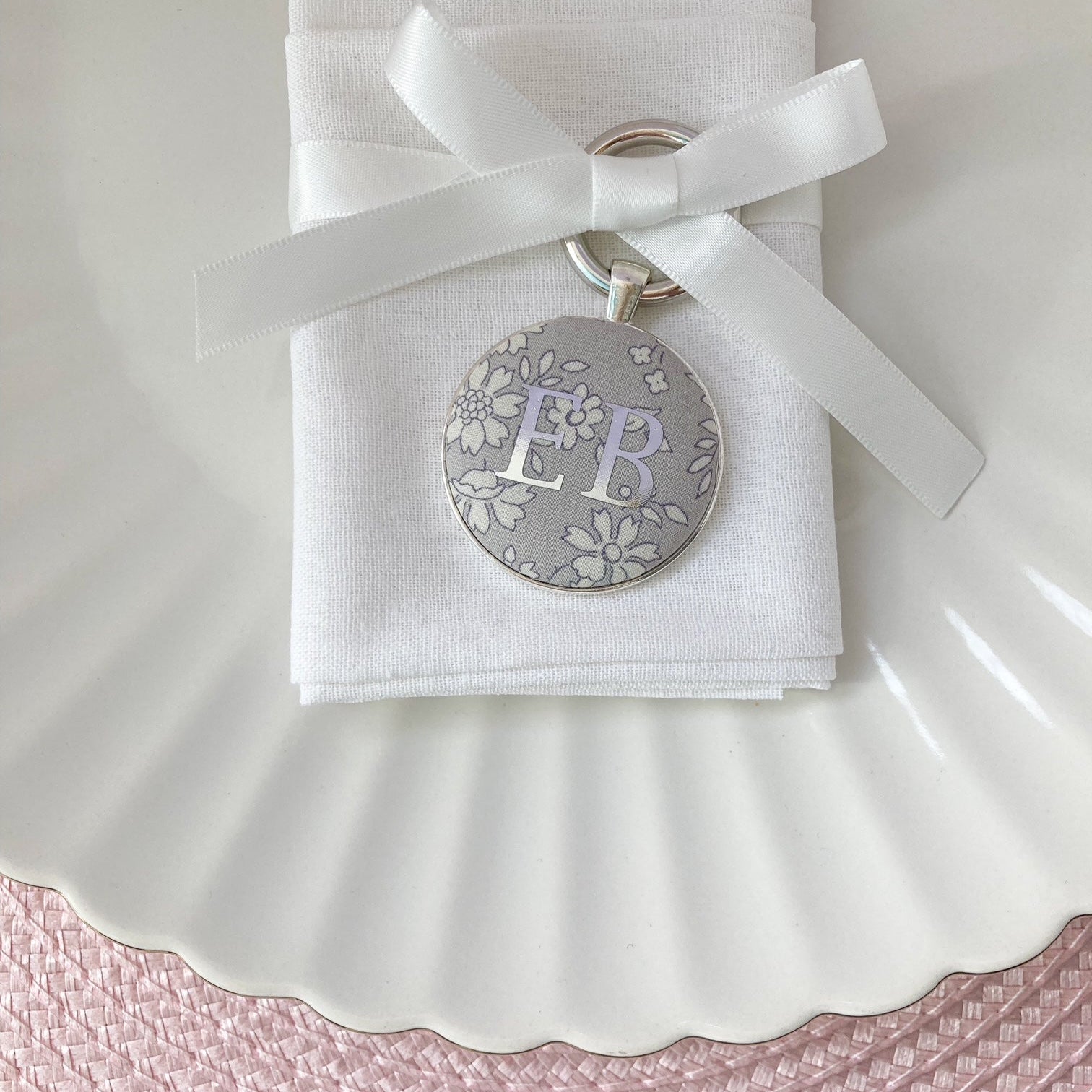 Wedding place setting and napkin ring made with grey floral Liberty fabric