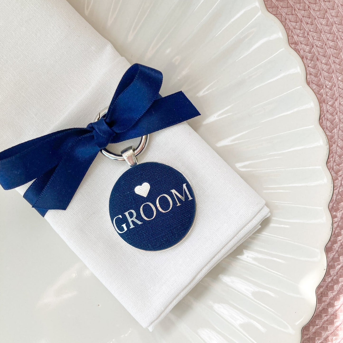 Groom wedding place setting and keepsake in navy blue linen with ribbon
