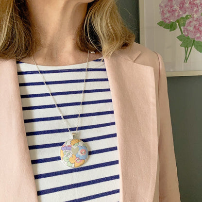 Liberty floral heart necklace worn with a stripy top