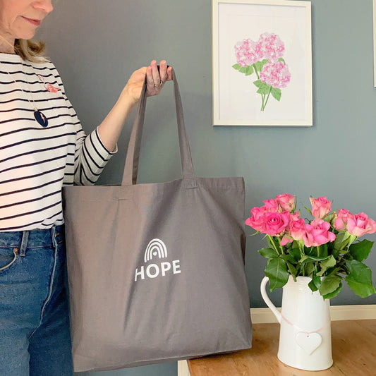 Large grey tote bag printed with the word Hope