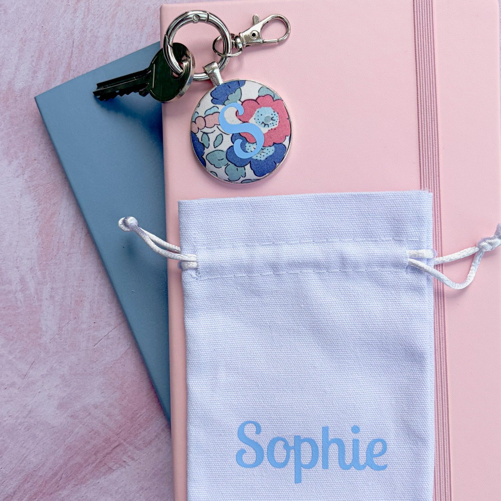 Keyring made with floral fabric and a personalised initial, with a gift pouch printed with 'Sophie' 