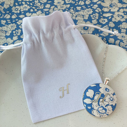 Initial necklace printed on blue Betsy fabric