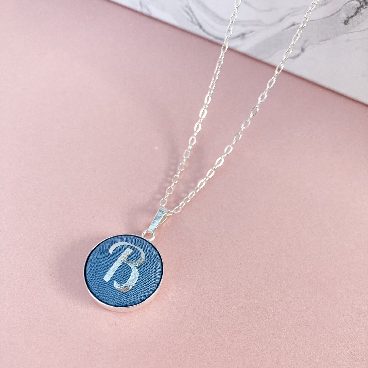 Personalised initial necklace in blue fabric