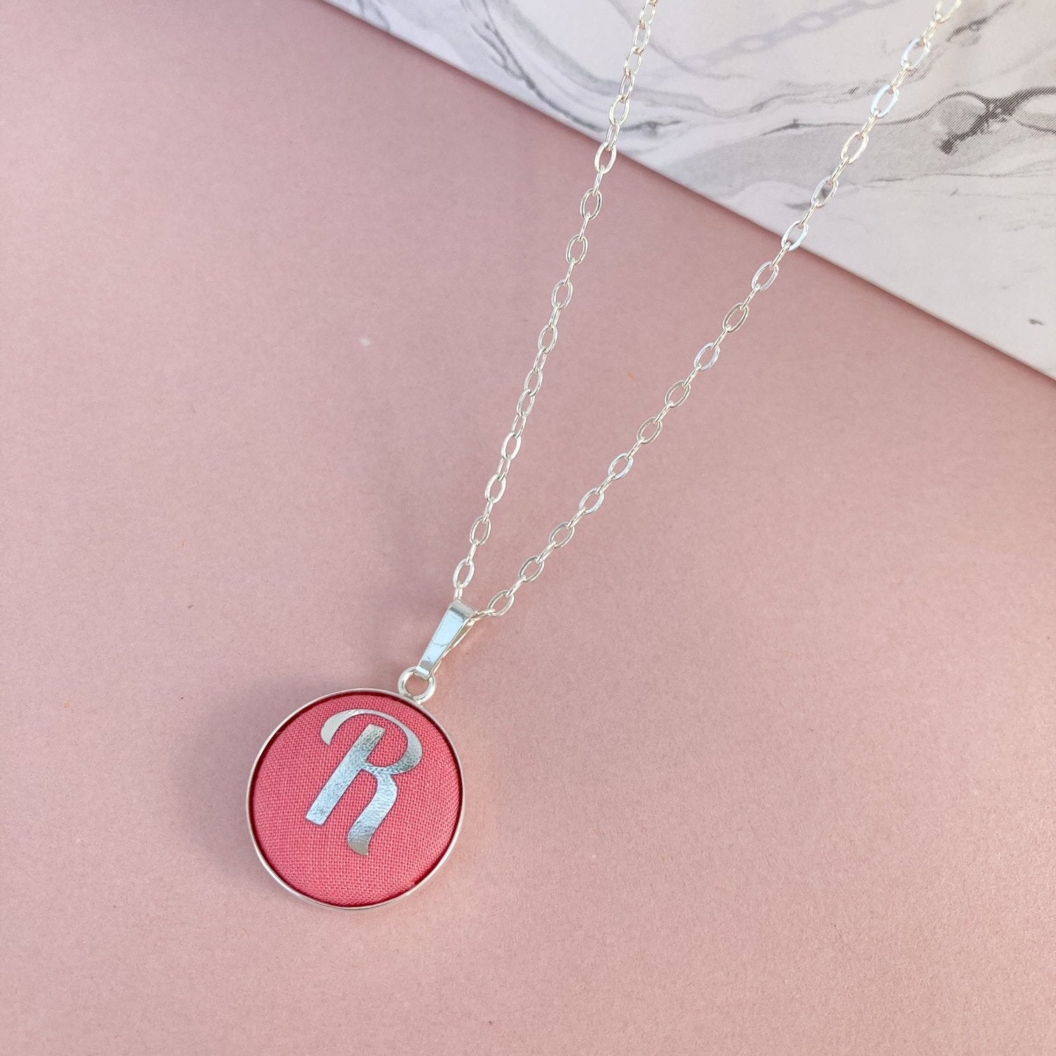 Personalised initial necklace in coral pink with R in silver foil