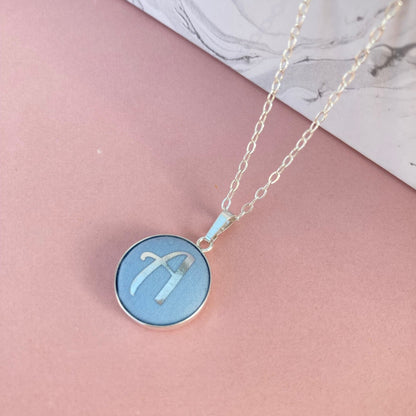 Pale blue initial necklace 