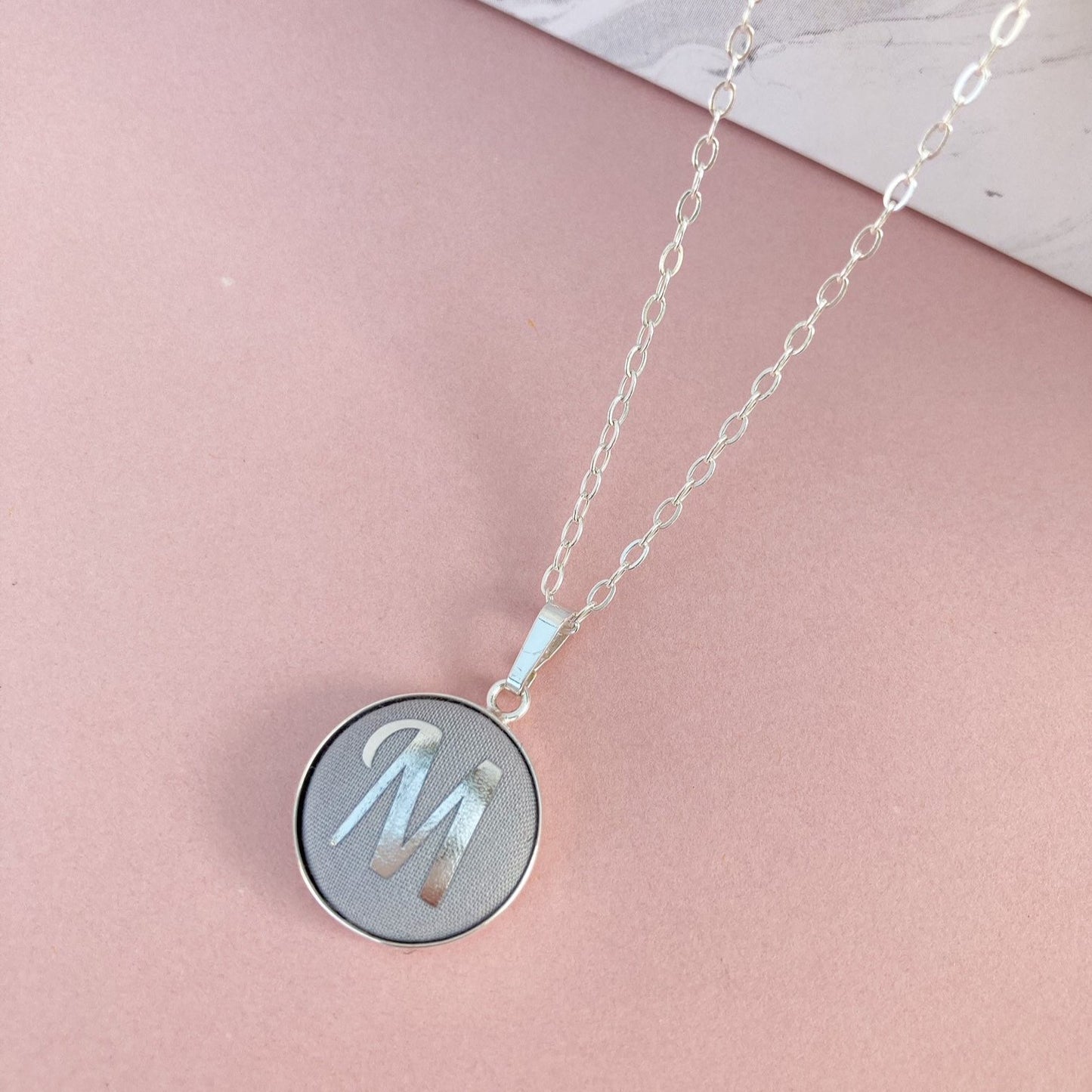 Grey fabric necklace with silver foil initial