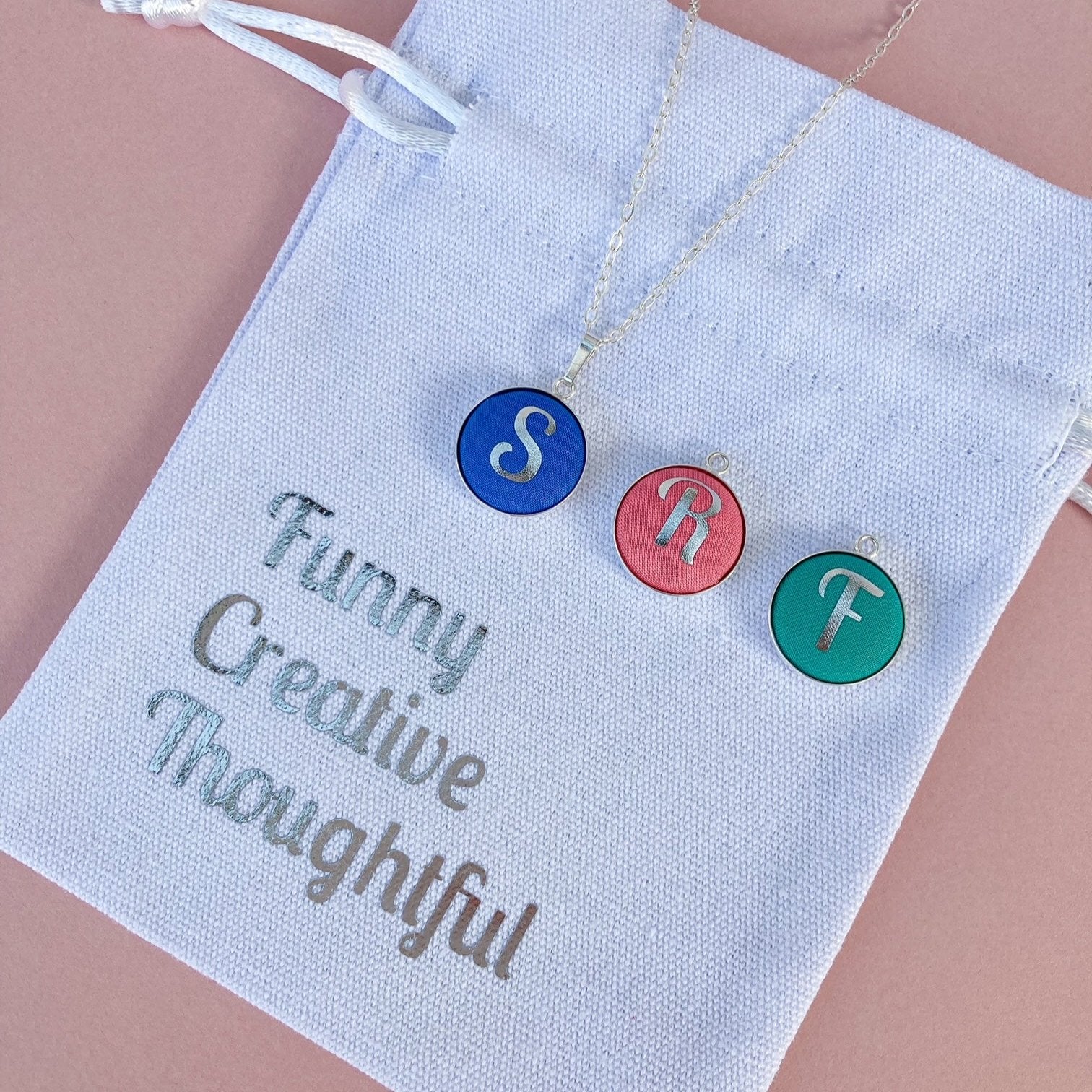 Initial necklaces in personalised printed pouch