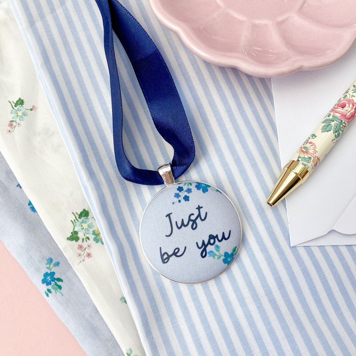 Just Be You Thoughtful Keepsake on blue floral Liberty fabric with a blue ribbon