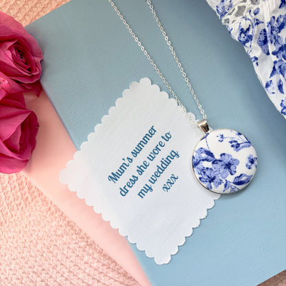 Blue floral fabric necklace with a fabric printed message