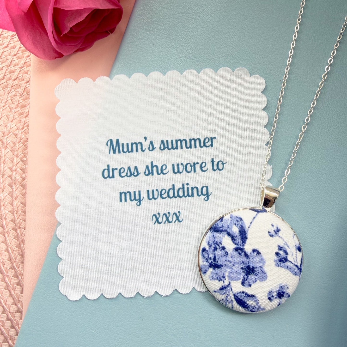 Blue floral pendant and a fabric message