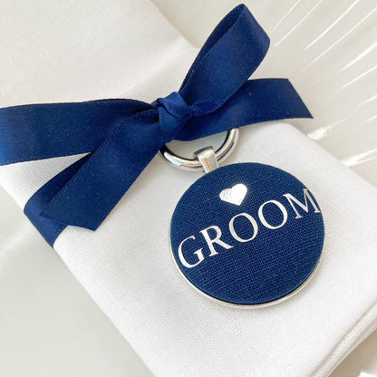 Navy groom wedding breakfast place setting and favour with ribbon