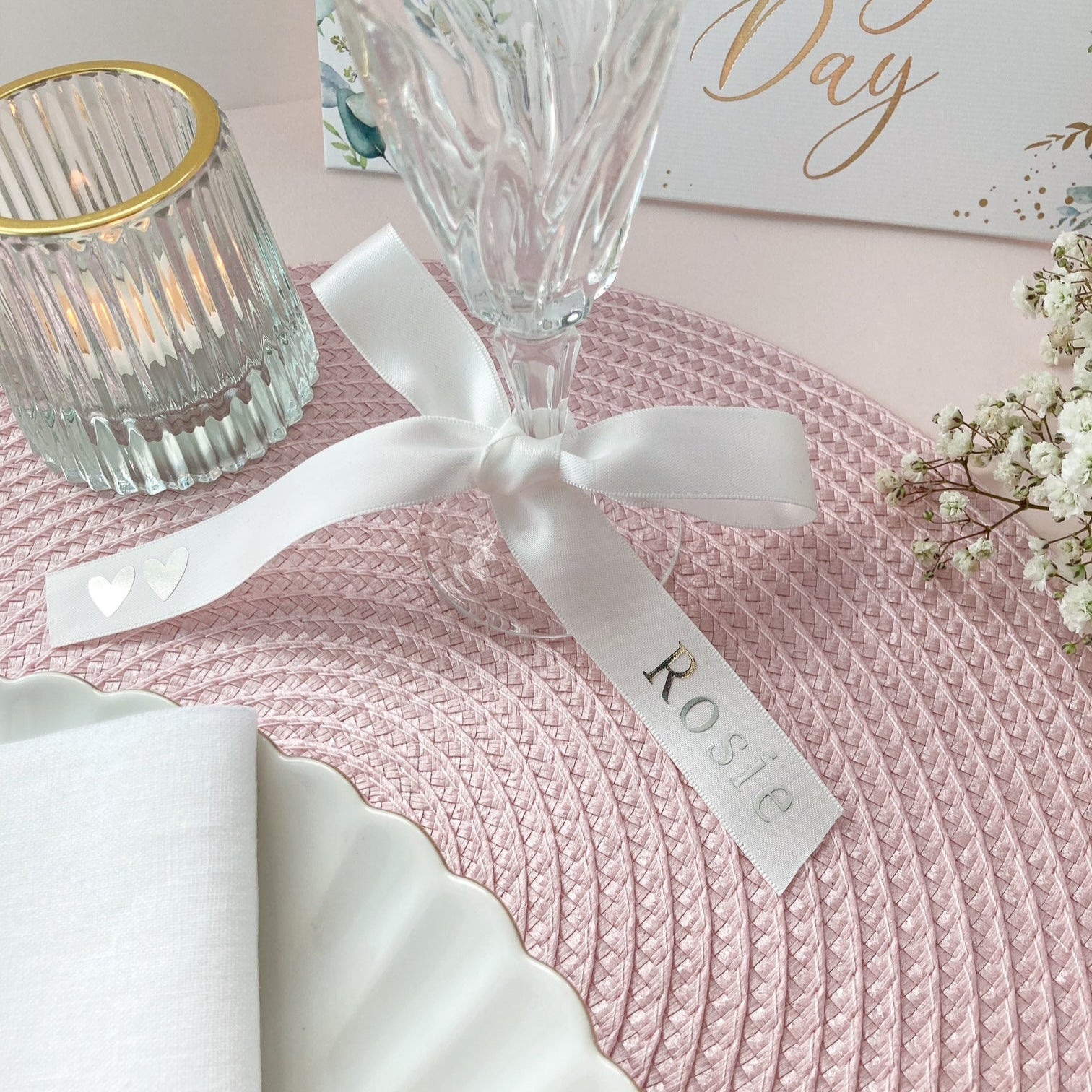 Personalised glass ribbons for wedding place setting in white stain with names in silver