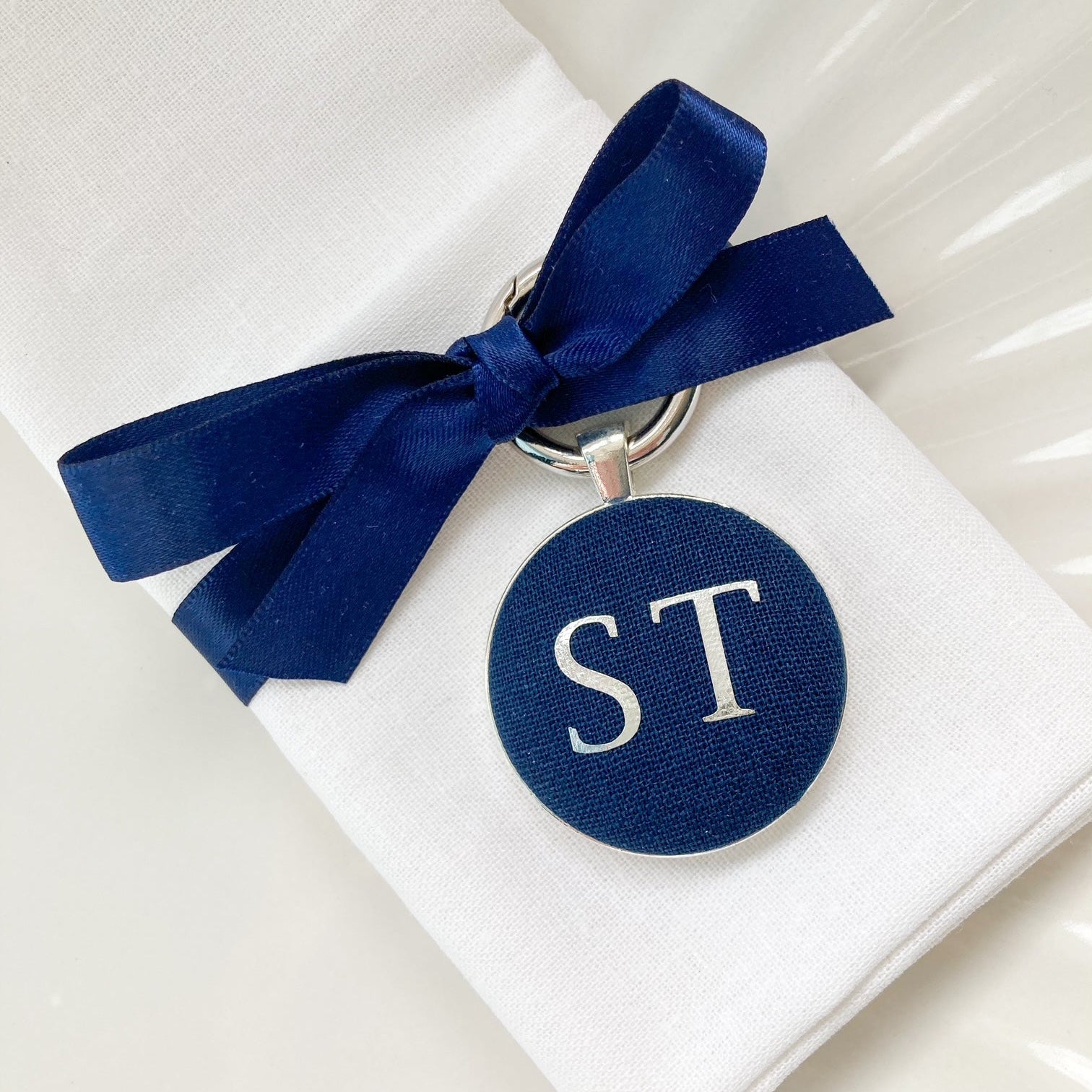 Personalised wedding breakfast and favour keyring in navy blue linen fabric with initials