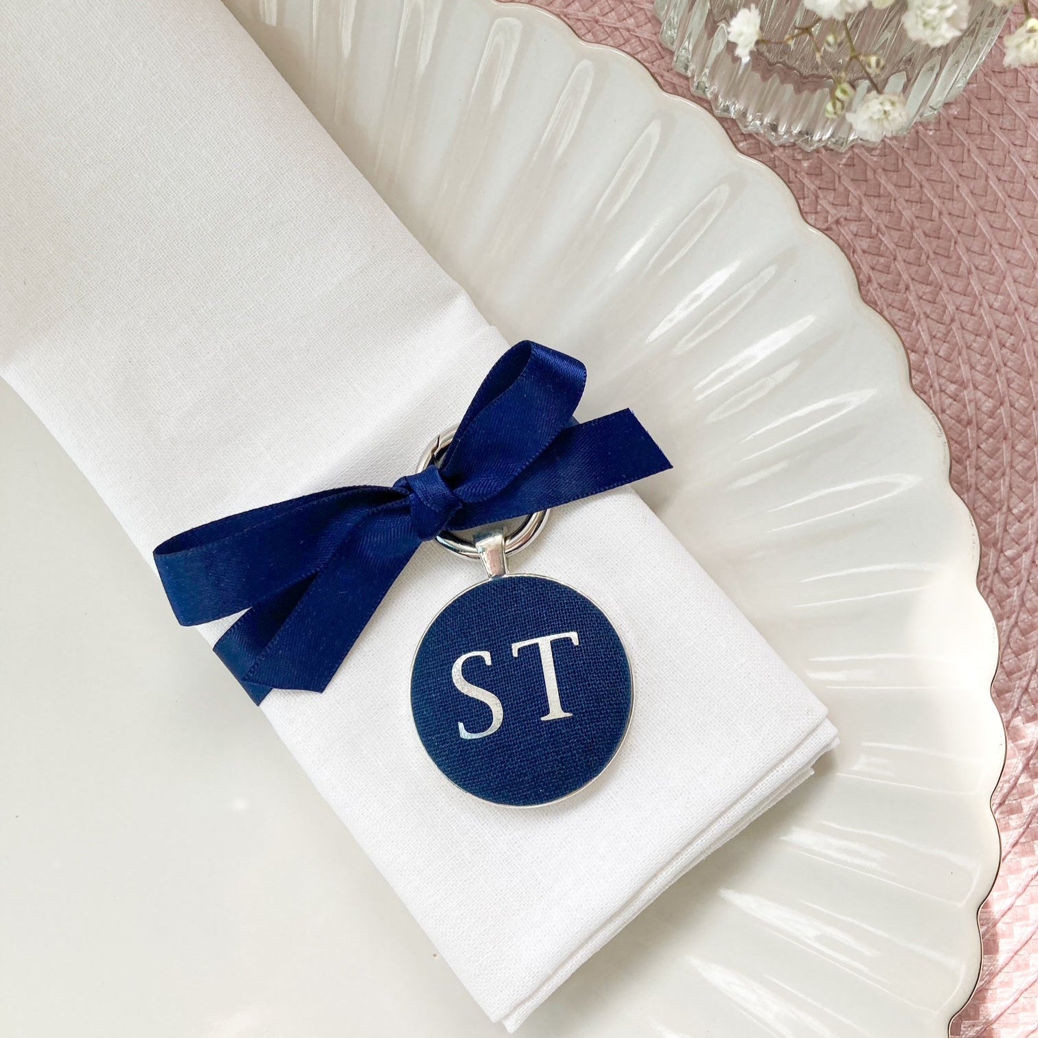Personalised wedding place setting and favour in navy blue linen with initials