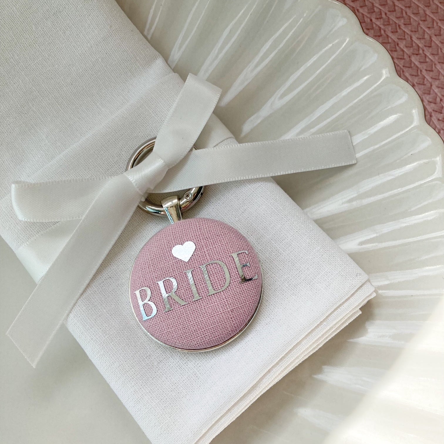Pink bride wedding breakfast place setting and favour