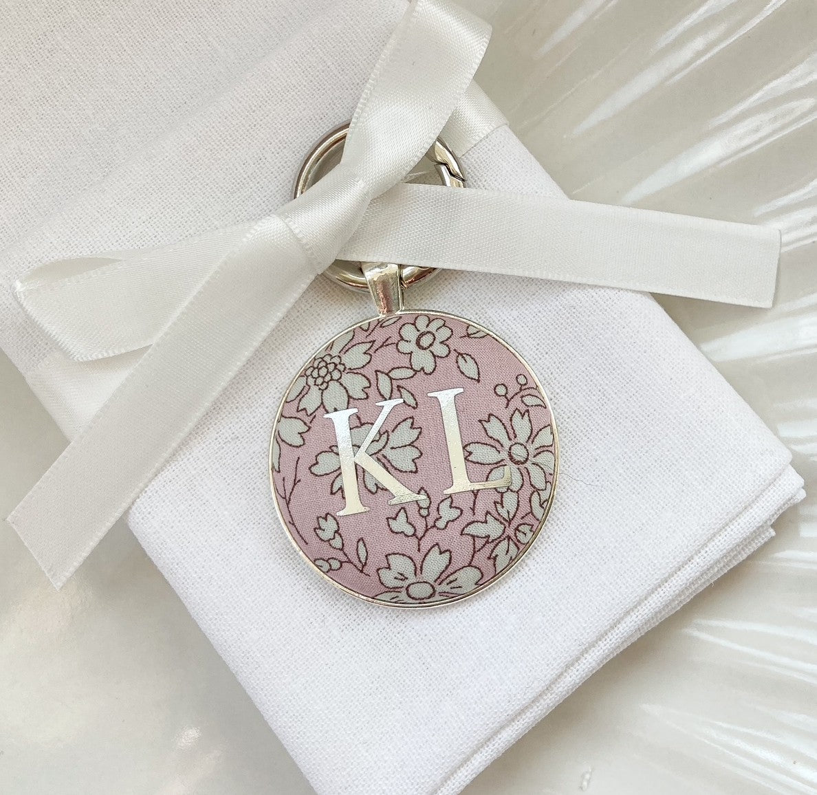 Wedding place setting and favour keyring made with Liberty pink floral fabric