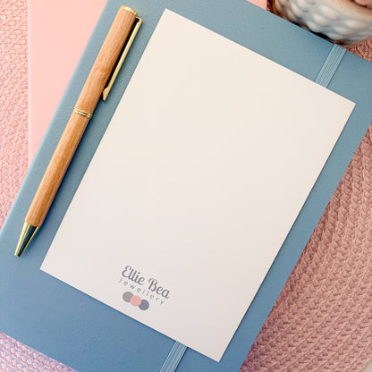 Plain white reverse of a postcard with the Ellie Bea logo