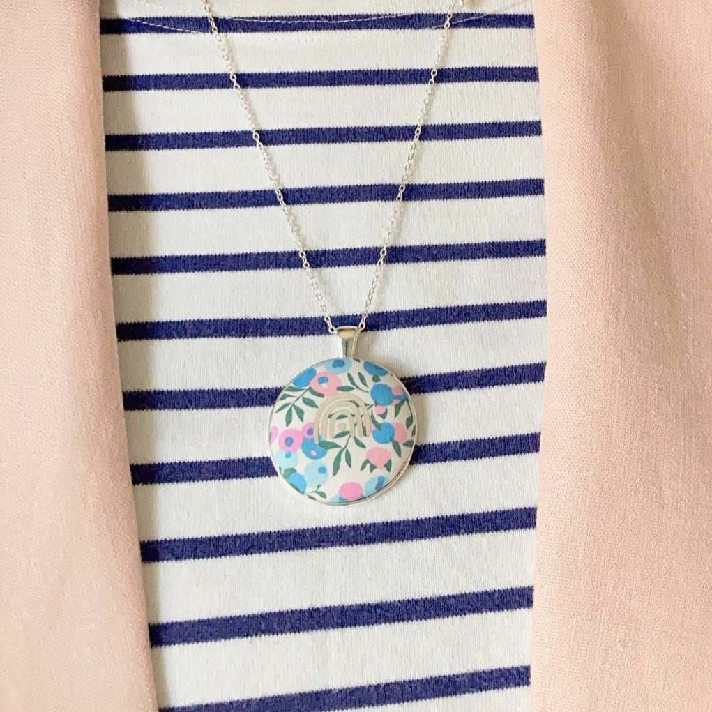 Rainbow necklace with Liberty fabric worn with a stripy top