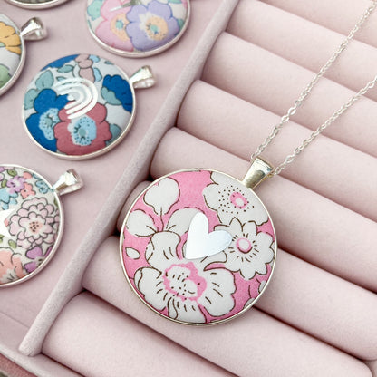 Pink floral fabric necklace with a silver heart in a pink jewellery box