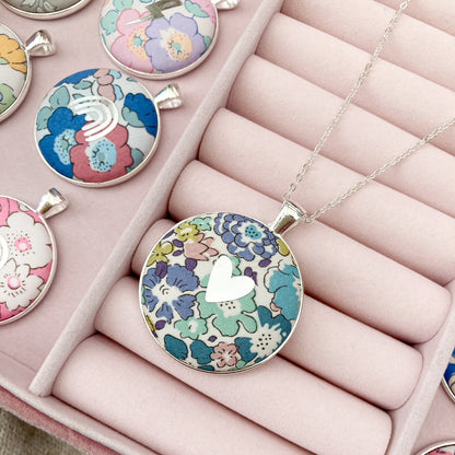 Teal & purple floral necklace with silver heart in a pink jewellery box