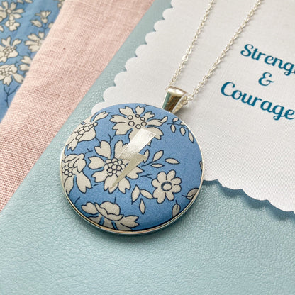 Lightning necklace printed onto a blue floral Liberty fabric