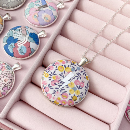 Yellow & pink liberty floral necklace with lightning symbol in a pink jewellery box