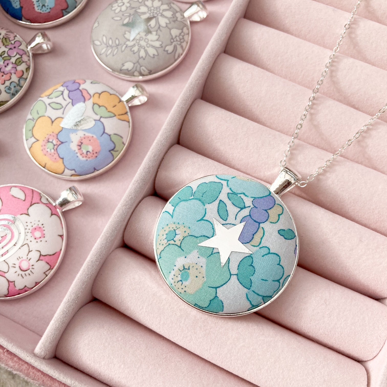 Aqua & lilac fabric necklace with star design in a pink jewellery box