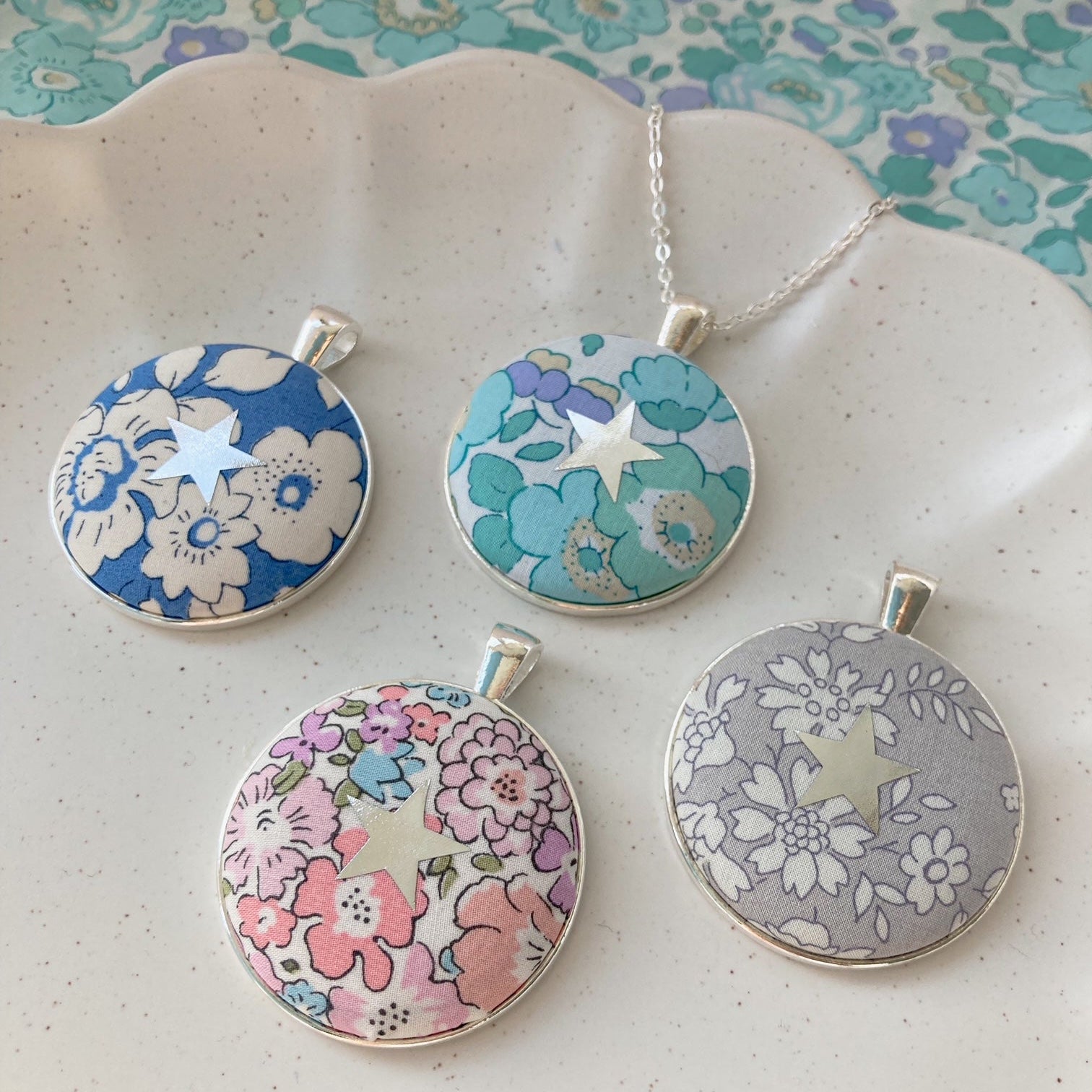 Star necklaces made with floral Liberty fabrics