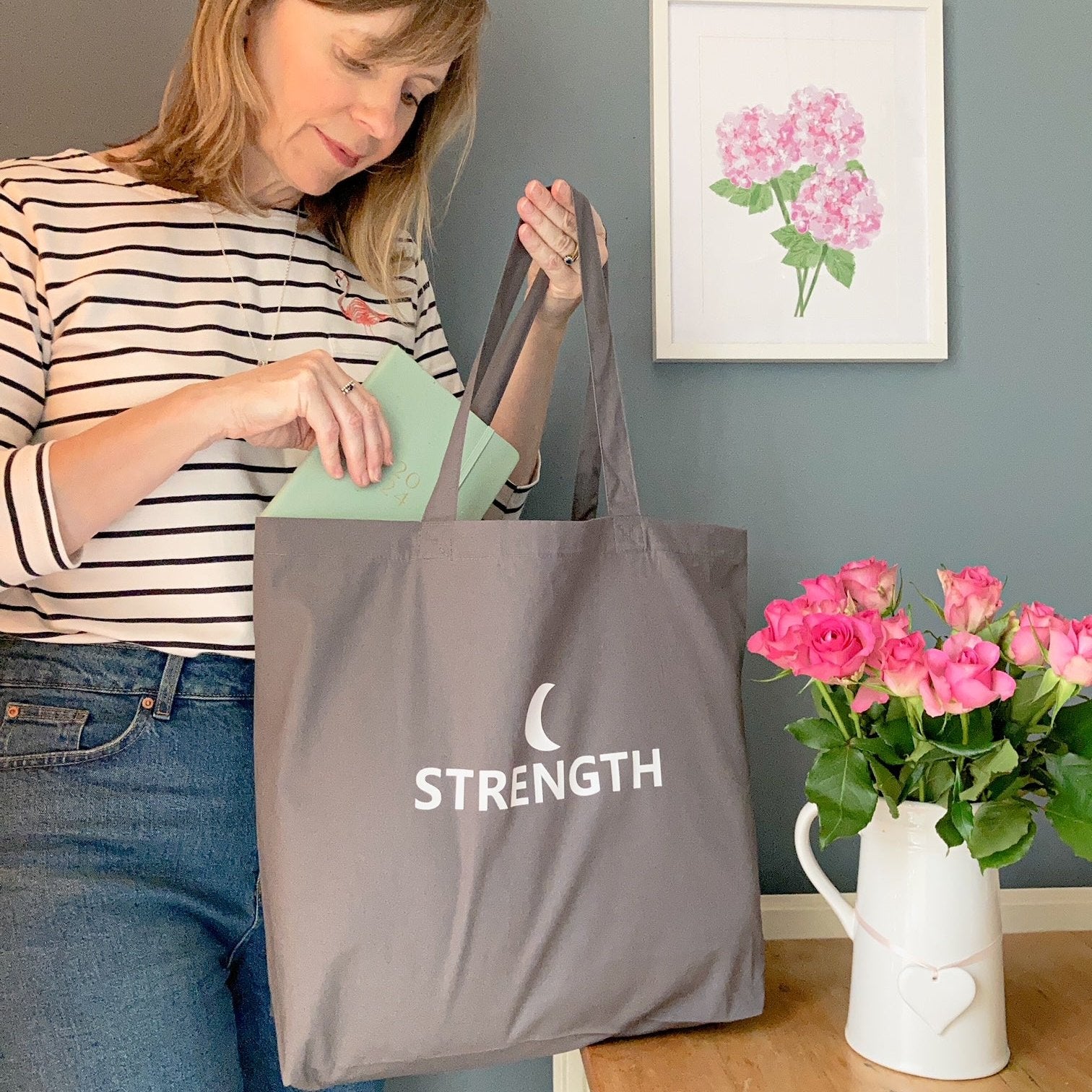 Strength tote bag with a crescent moon