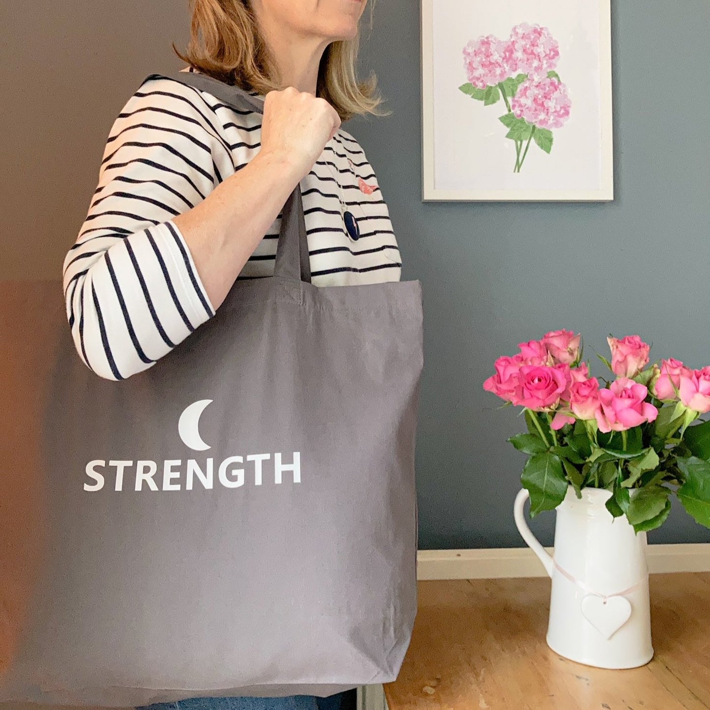 Roomy tote bag with strength printed in white