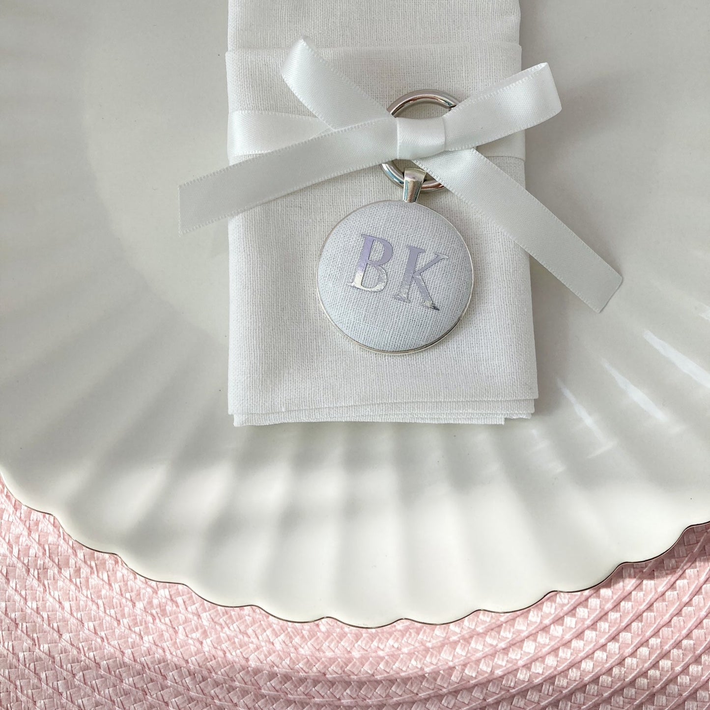 Wedding place setting and favour keyring in white linen fabric personalised with initials