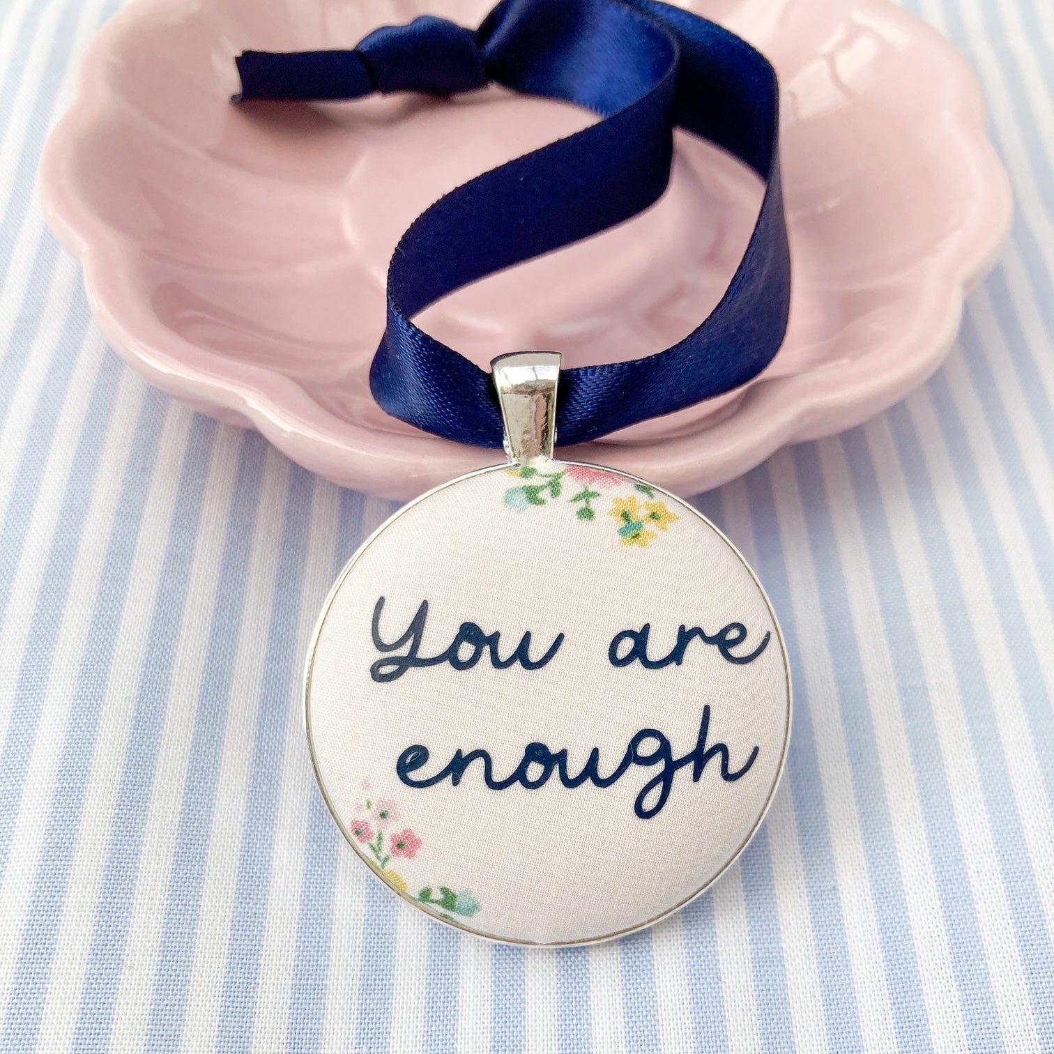 You Are Enough keepsake made with cream floral Liberty fabric on a blue ribbon