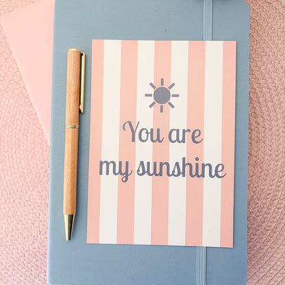 You are my sunshine postcard with a pink and white striped design