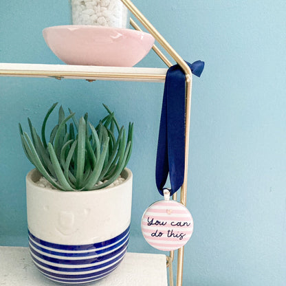 You Can Do This keepsake printed onto pink and white striped fabric with a navy blue ribbon