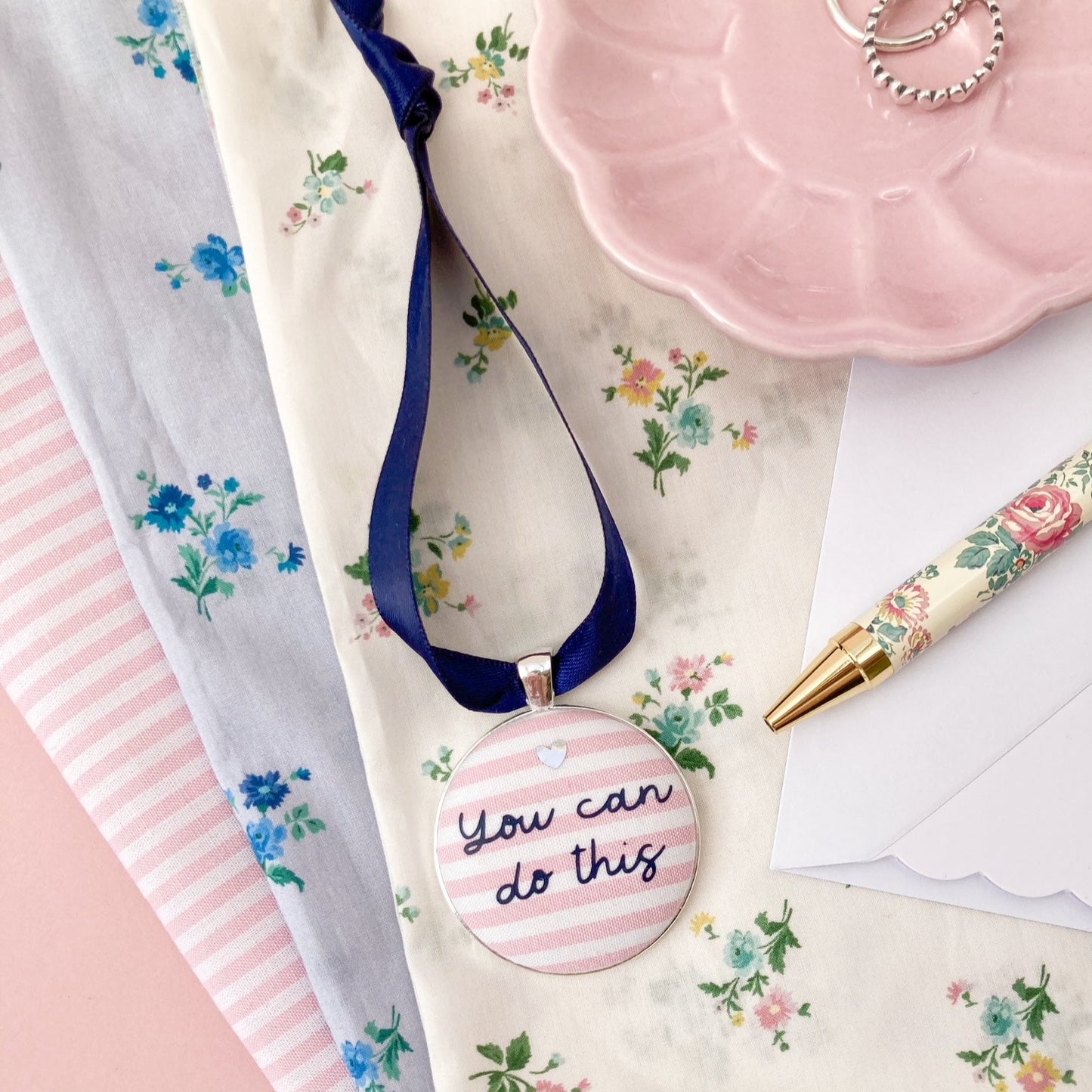 You Can Do This keepsake printed onto pink and white striped fabric with a navy blue ribbon